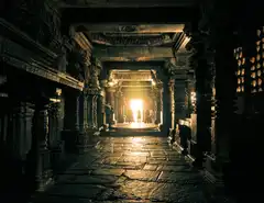 Sunlight streams into ancient stone temple corridor.